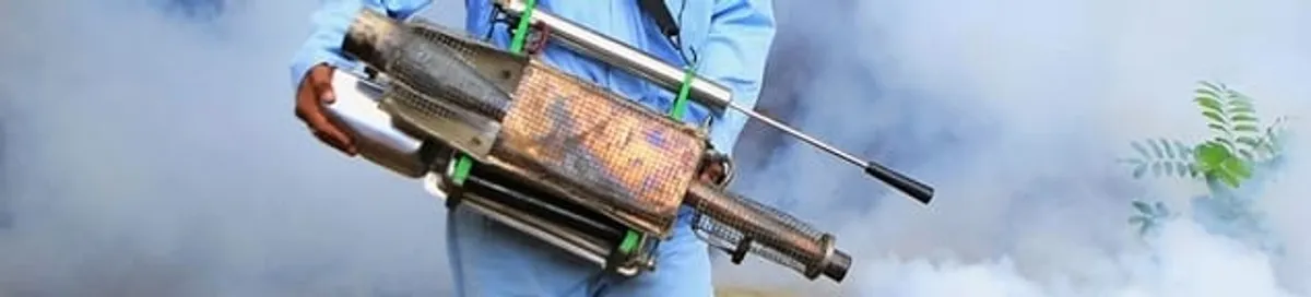 Fumigation technician using a fogger for deep pest treatment in Stamford, CT